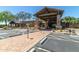 Community entrance and parking area with professionally landscaped surroundings at 7939 E Stonecliff Cir, Mesa, AZ 85207