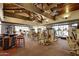 Community gym with modern exercise equipment, ceiling fans, and ample workout space at 7939 E Stonecliff Cir, Mesa, AZ 85207