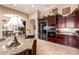 Spacious kitchen with granite countertops, dark cabinets, and modern appliances at 7939 E Stonecliff Cir, Mesa, AZ 85207