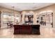 Spacious kitchen with granite countertops, an island, and open layout seamlessly connects to adjacent living spaces at 7939 E Stonecliff Cir, Mesa, AZ 85207