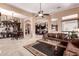 Expansive living area with seamless transitions between spaces, showcasing elegant décor and comfortable living at 7939 E Stonecliff Cir, Mesa, AZ 85207