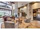 Grand lobby features stone columns, fireplace, soaring ceilings, and comfortable seating area at 7939 E Stonecliff Cir, Mesa, AZ 85207