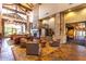 A luxurious lobby showcasing stone accents, fireplace, wood beams, and plush seating for relaxation at 7939 E Stonecliff Cir, Mesa, AZ 85207