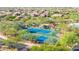 Aerial view of community tennis courts and lush landscaping, offering recreational amenities for residents at 7939 E Stonecliff Cir, Mesa, AZ 85207
