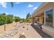 Covered patio overlooking well-maintained desert landscaping with green foliage at 8426 W Utopia Rd, Peoria, AZ 85382