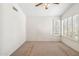 Bright bedroom with neutral carpet, window shutters, and ample space at 8426 W Utopia Rd, Peoria, AZ 85382