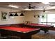 Bright community game room featuring pool tables and ample lighting for entertaining at 8426 W Utopia Rd, Peoria, AZ 85382