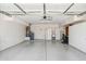 Spacious two car garage with sink, storage cabinets, and workbench at 8426 W Utopia Rd, Peoria, AZ 85382