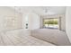 Bright living room featuring tile flooring, chandelier, and sliding door to backyard at 8426 W Utopia Rd, Peoria, AZ 85382