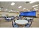 Spacious meeting room with ample seating, a large stage, and bright lighting suitable for various events and gatherings at 8426 W Utopia Rd, Peoria, AZ 85382