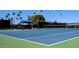Well-maintained tennis court on a sunny day, perfect for recreational games and enjoying an active lifestyle at 8426 W Utopia Rd, Peoria, AZ 85382