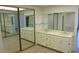 Bathroom featuring a double vanity with large mirrors and plenty of storage at 8626 E Irish Hunter Trl, Scottsdale, AZ 85258