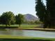 Scenic view of the golf course with Camelback Mountain in the distance at 8626 E Irish Hunter Trl, Scottsdale, AZ 85258