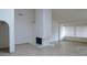 Spacious living room with high ceilings, a fireplace and large windows at 8626 E Irish Hunter Trl, Scottsdale, AZ 85258