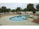 Backyard featuring a private kidney-shaped pool, landscaping, and block fencing at 8626 E Irish Hunter Trl, Scottsdale, AZ 85258