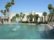 Stunning water feature with a fountain surrounded by palm trees and lush landscaping at 8626 E Irish Hunter Trl, Scottsdale, AZ 85258