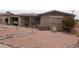 Front exterior view of a brick home with low maintenance desert landscaping at 962 S Main Dr, Apache Junction, AZ 85120