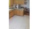 A charming kitchen area featuring laminate counters and tile flooring at 962 S Main Dr, Apache Junction, AZ 85120