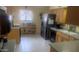 Bright kitchen featuring stainless steel appliances, laminate counters and tile floors at 962 S Main Dr, Apache Junction, AZ 85120