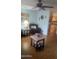 A stylish living room showcases a ceiling fan, comfortable seating and laminate floors at 962 S Main Dr, Apache Junction, AZ 85120