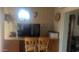 Office space complete with desk, chairs, tv, storage and paneled walls at 962 S Main Dr, Apache Junction, AZ 85120