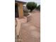 Relaxing outdoor patio with decorative pavers and low brick wall, perfect for entertaining guests or enjoying the weather at 962 S Main Dr, Apache Junction, AZ 85120