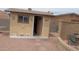 Backyard shed decorated with art, providing extra storage space and potential for a hobby room or workshop at 962 S Main Dr, Apache Junction, AZ 85120