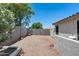 Spacious backyard with low-maintenance desert landscaping and privacy walls at 10557 W Louise Dr, Peoria, AZ 85383