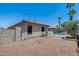 View of the rear exterior, backyard, and pool from the side yard at 10557 W Louise Dr, Peoria, AZ 85383