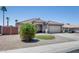 Lovely single-story home with well-maintained desert landscaping and an attached two-car garage at 10557 W Louise Dr, Peoria, AZ 85383