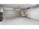 Spacious garage with ample storage space and an automatic garage door opener at 10557 W Louise Dr, Peoria, AZ 85383