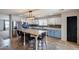 Spacious kitchen featuring an island with seating, updated appliances and plenty of counter space at 10557 W Louise Dr, Peoria, AZ 85383