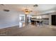 Expansive kitchen with stainless appliances, island seating, and direct living room access at 10557 W Louise Dr, Peoria, AZ 85383
