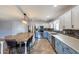 Spacious kitchen with two-tone cabinets, stainless steel appliances, and a large center island at 10557 W Louise Dr, Peoria, AZ 85383