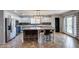 Stylish kitchen with stainless steel appliances, a kitchen island and blue-and-white cabinetry at 10557 W Louise Dr, Peoria, AZ 85383