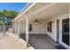 Large covered patio features brick pavers and a ceiling fan at 10557 W Louise Dr, Peoria, AZ 85383