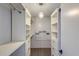 Organized walk-in closet with custom shelving, drawers, and ample storage space at 10557 W Louise Dr, Peoria, AZ 85383