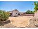 A backyard featuring gravel and a block fence at 11154 W Ashley Chantil Dr, Surprise, AZ 85378