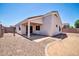 A backyard featuring gravel and a block fence at 11154 W Ashley Chantil Dr, Surprise, AZ 85378