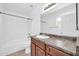 Clean bathroom features a vanity with storage and a shower-tub combination at 11154 W Ashley Chantil Dr, Surprise, AZ 85378