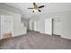 Large main bedroom with high ceilings, a ceiling fan, and an ensuite bathroom at 11154 W Ashley Chantil Dr, Surprise, AZ 85378
