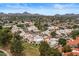 This aerial view highlights the serene community, desert landscape, and stunning mountain views beyond at 11633 N 40Th Way, Phoenix, AZ 85028