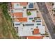 This aerial view showcases the property's rooftops, landscaping, solar panels, and outdoor patio space at 11633 N 40Th Way, Phoenix, AZ 85028