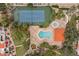 An aerial view features a pool, tennis court, landscaped surroundings, and community amenities at 11633 N 40Th Way, Phoenix, AZ 85028