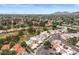 Expansive aerial view of a neighborhood surrounded by lush greenery and mature trees at 11633 N 40Th Way, Phoenix, AZ 85028