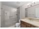 Upgraded shower with glass enclosure, rainfall shower head, and stylish vanity at 11633 N 40Th Way, Phoenix, AZ 85028