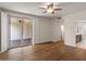 Spacious room features hardwood flooring, sliding glass doors to the patio, and an adjoining bathroom at 11633 N 40Th Way, Phoenix, AZ 85028
