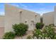 Exterior showing stucco texture with green landscaping and utility access at 11633 N 40Th Way, Phoenix, AZ 85028
