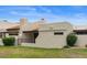 Exterior shot of the home features mature landscaping and a private patio at 11633 N 40Th Way, Phoenix, AZ 85028