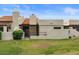 Exterior shot of home shows lawn, desert landscaping and a private back patio at 11633 N 40Th Way, Phoenix, AZ 85028
